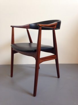 Danish teak armchair with carved armrests